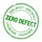 Grunge green zero defect word round rubber stamp on white background