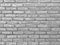 Grunge horizontal blackâ€‹ andâ€‹ whiteâ€‹ tone brick wall.