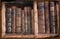 Grunge image of antique books in bookcase