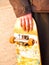 Grunge image of a skater holding his skateboard