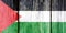 Grunge pattern of Palestine national flag isolated on weathered wooden fence board