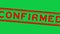 Grunge red confirmed word square rubber stamp zoom in green background