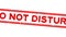 Grunge red do not disturb word square rubber stamp zoom in white background