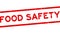 Grunge red food safety word square rubber stamp zoom on white background