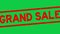 Grunge red grand sale word square rubber stamp zoom on green background