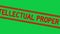 Grunge red intellectual property word square rubber stamp zoom on green background