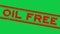 Grunge red oil free word rubber stamp zoom on green background