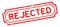 Grunge red rejected word rubber business stamp on white background