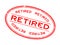 Grunge red retired word oval rubber stamp on white background