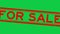 Grunge red for sale word square rubber stamp zoom on green background