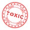 Grunge red toxic word round rubber stamp on white background