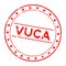 Grunge red vuca abbreviation of Volatility, uncertainty, complexity and ambiguity word round rubber stamp on white