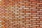 Grunge Red yellow beige tan fine brick wall texture background perspective, large detailed horizontal closeup