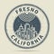 Grunge rubber stamp or label with text Fresno, California
