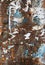 Grunge shabby texture. Rusty metal mailbox with peeling paint and paper. Blue, white, brown