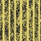 Grunge spotted black and yellow vector seamless pattern. Striped textured background.