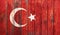 Grunge Turkish flag on a wooden fence