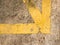 Grunge yellow line cross as corner on stained concrete background