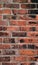 Grungy brick wall set with old fashioned mortar