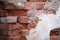 Grungy brown brick texture with white plaster