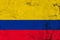 Grungy colombia flag on a concrete wall surface