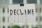 grungy decline sign,recession,business and economic activities concept, blurred office building in the back