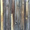 Grungy distressed grey wooden textured fence