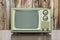 Grungy Green Vintage Television with Old Wood Paneling