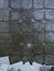 Grungy grey old tile wall background texture. Abandoned, depressive, post-apocalypse atmosphere