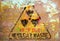 Grungy nuclear atom waste warning sign, rotten and rusty, symbol for dangers of atomic energy
