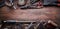 Grungy old tools on a wooden background