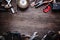 Grungy old tools on a wooden background