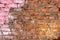 Grungy Red Brick Wall With Pink Paint Splatter