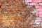 Grungy Red Brick Wall With Pink Paint Splatter