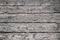 Grungy weathered horizontal black painted barn boards on an old