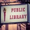 Grungy and Weathered Public Library Sign