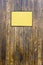 Grungy wood texture with a yellow sign