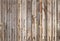 Grungy wooden wall front view, seamless background