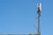 GSM cell tower. Telecommunications 5G, 4G, equipment on blue sky background, copy space