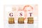 GST or Good and Services Tax concept with stack of coin and Singapore Dollar currency as backdrop