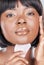 Gua Sha, beauty and black woman portrait with cosmetics, skincare and dermatology in studio. Wellness, youth serum and