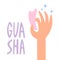 Gua sha rose quartz stone for facial massage. Guasha acupuncture treatment concept.