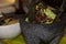 Guacamole with chapulines on molcajete. traditional mexican food