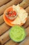 Guacamole dip with chips and salsa