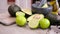 guacamole ingredients - Avocados, limes whole and cut on concrete table with a marble mortar