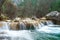 Guadalquivir River as it passed through the Sierra de Cazorla, Segura and las Villas after its birth. Small waterfall on the