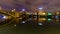 Guadalquivir river of Seville, night scene with lights in the city and reflections in the calm water, panoramic cityscape