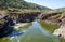 Guadiana river flows through the deep gully in schists. Pulo do