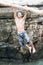 GUALACA, PANAMA - MAY 23, 2016: Local male jumps in a water in Los Cangilones de Gualaca - mini canyon in Pana