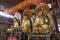 Guangzhou, China - December 28, 2018: Statues of ancient chinese artistic golden buddhas, in temple of the six banyan trees (